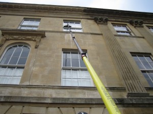 Clean and bright windows cleaning a high window on a Bath property